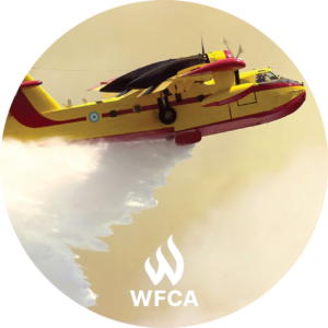 Circle photo, branded. A small yellow plane with red on the underside & red side stripes. It is dumping water from the underside.